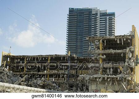Stock Photograph - Demolished building in front of another building. Fotosearch