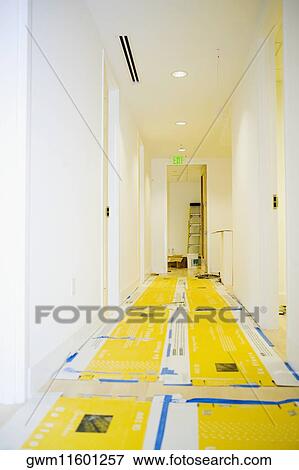 Drop cloth lining in a corridor View Large Photo Image Stock Photo - Drop cloth lining in a corridor. Fotosearch