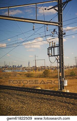 Stock Photo - Electricity pylon at a railroad track. Fotosearch