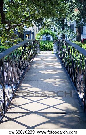 Entrance of a footbridge covered with ivy, Savannah, Georgia, USA View Large Photo Image Stock Photo - Entrance of a footbridge covered with ivy, Savannah, Georgia, USA. Fotosearch