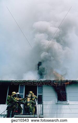 Firemen at work on a burning house in Maryland View Large Photo Image Stock Image - Firemen at work on a burning house in Maryland. Fotosearch