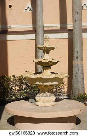 Fountain in front of a wall View Large Photo Image Stock Image - Fountain in front of a wall. Fotosearch