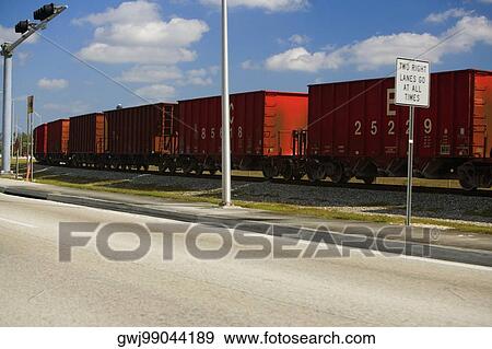 Freight train on a railroad track, Miami, Florida, USA View Large Photo Image Stock Photo - Freight train on a railroad track, Miami, Florida, USA. Fotosearch