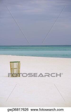 Garbage bins on the beach View Large Photo Image Stock Photograph - Garbage bins on the beach. Fotosearch