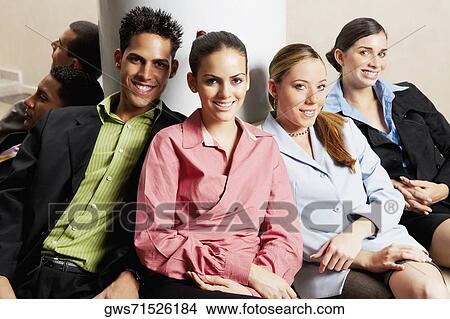 Group of business executives sitting together View Large Photo Image Picture - Group of business executives sitting together. Fotosearch