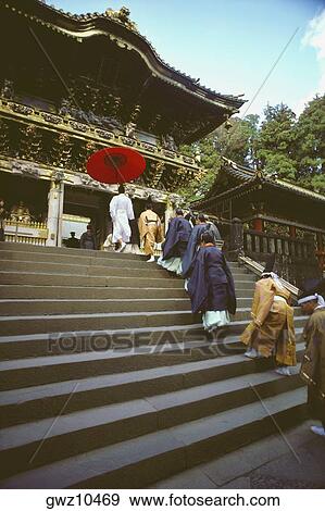 Stock Photo - Group of people in a religious procession at a shrine, Yomeimon Gate, Toshu-Gu Shrine, Nikko, Tochigi prefecture, Japan. Fotosearch