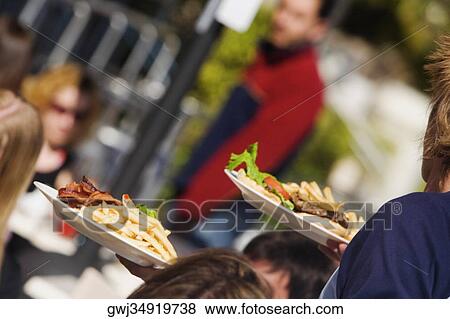 Group of people in a restaurant View Large Photo Image Stock Photo - Group of people in a restaurant. Fotosearch