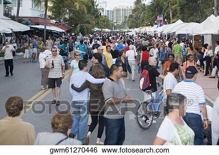 Group of people in a street market View Large Photo Image Stock Photograph - Group of people in a street market. Fotosearch
