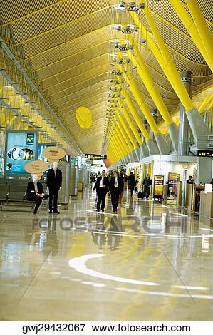 Group of people inside a terminal, Madrid, Spain View Large Photo Image Stock Photo - Group of people inside a terminal, Madrid, Spain. Fotosearch