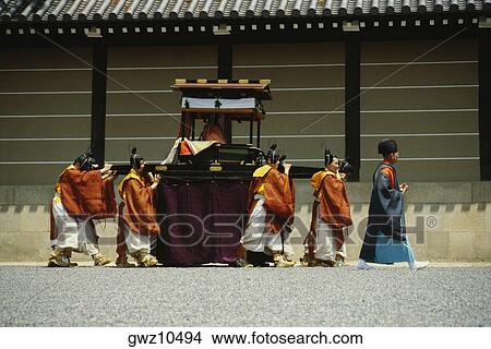Picture - Group of people walking in a procession, Hollyhock festival, Kyoto Prefecture, Japan. Fotosearch