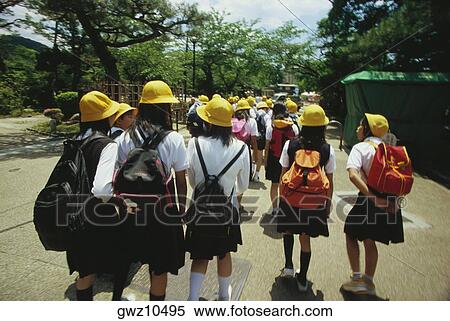 Stock Photography - Group of schoolgirls walking on the road, Kyoto Prefecture, Japan. Fotosearch
