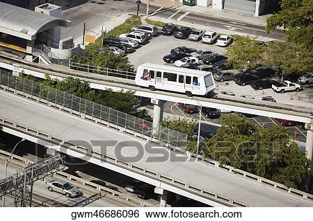 High angle view of a bus moving on an overpass View Large Photo Image Stock Photograph - High angle view of a bus moving on an overpass. Fotosearch