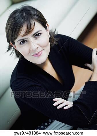Picture - High angle view of a businesswoman with her arms crossed. Fotosearch