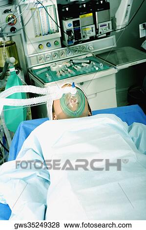 High angle view of a female patient lying on an operating table View Large Photo Image Stock Photo - High angle view of a female patient lying on an operating table. Fotosearch