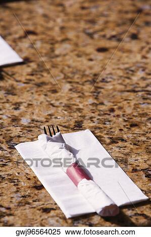 High angle view of a fork wrapped in a napkin View Large Photo Image Stock Photography - High angle view of a fork wrapped in a napkin. Fotosearch