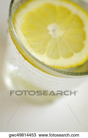 High angle view of a glass of lemonade View Large Photo Image Stock Image - High angle view of a glass of lemonade. Fotosearch