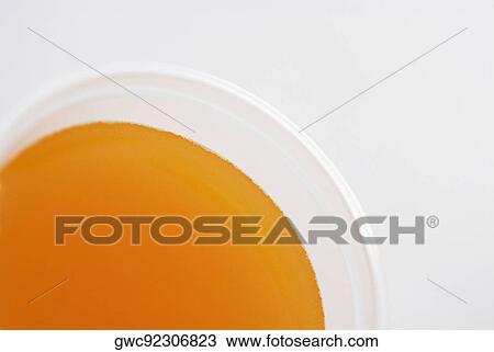 Stock Image - High angle view of a glass of orange juice. Fotosearch
