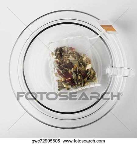 High angle view of a herbal teabag in a cup View Large Photo Image Stock Photography - High angle view of a herbal teabag in a cup. Fotosearch