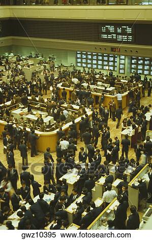 High angle view of a large group of people standing in stock exchange, Tokyo Stock Exchange, Tokyo Prefecture, Japan View Large Photo Image Stock Photography - High angle view of a large group of people standing in stock exchange, Tokyo Stock Exchange, Tokyo Prefecture, Japan. Fotosearch