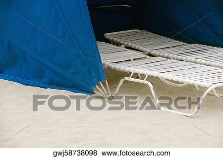 High angle view of a lounge chair under a tent View Large Photo Image Stock Photo - High angle view of a lounge chair under a tent. Fotosearch