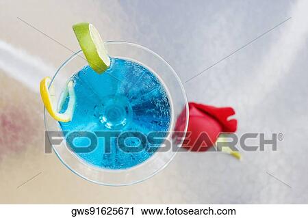 High angle view of a martini glass with a slice of lime on the table View Large Photo Image Stock Image - High angle view of a martini glass with a slice of lime on the table. Fotosearch
