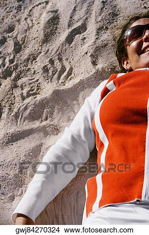 High angle view of a mid adult woman lying on her back View Large Photo Image Picture - High angle view of a mid adult woman lying on her back. Fotosearch