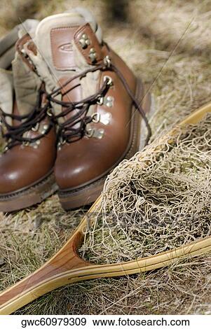 Stock Photo - High angle view of a pair of shoes and a fishing net. Fotosearch