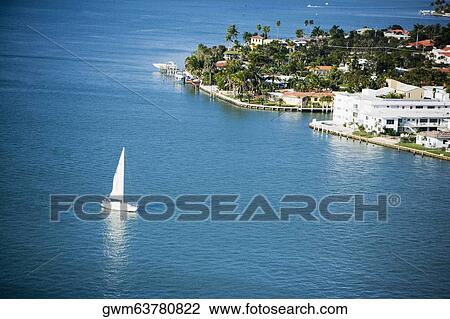 Stock Image - High angle view of a yacht in the sea. Fotosearch
