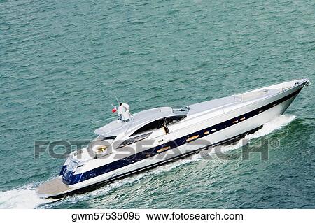 High angle view of a yacht moving in the sea View Large Photo Image Stock Photography - High angle view of a yacht moving in the sea. Fotosearch
