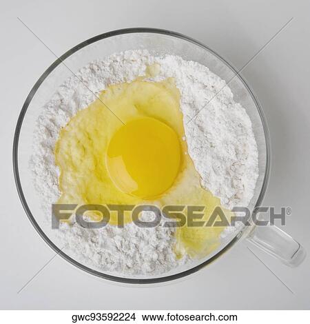 High angle view of a yolk in cup of flour View Large Photo Image Picture - High angle view of a yolk in cup of flour. Fotosearch