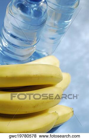 High angle view of bananas and two water bottles View Large Photo Image Stock Photo - High angle view of bananas and two water bottles. Fotosearch