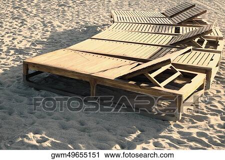 High angle view of lounge chairs on the beach View Large Photo Image Stock Image - High angle view of lounge chairs on the beach. Fotosearch