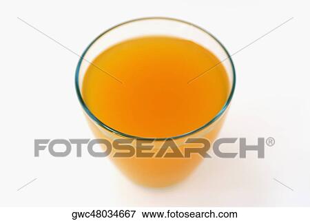 High angle view of orange juice in a glass View Large Photo Image Stock Photo - High angle view of orange juice in a glass. Fotosearch