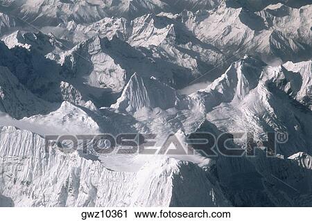High angle view of snow covered mountains, Himalayas, Tibet, China View Large Photo Image Stock Image - High angle view of snow covered mountains, Himalayas, Tibet, China. Fotosearch