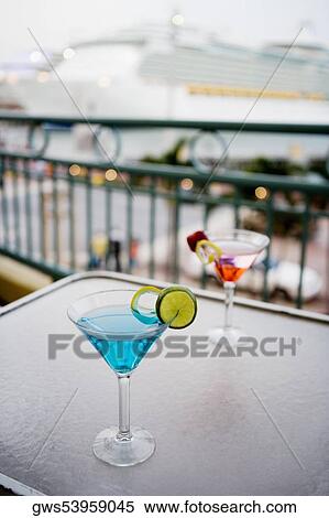 High angle view of two cocktails on the table View Large Photo Image Stock Photography - High angle view of two cocktails on the table. Fotosearch
