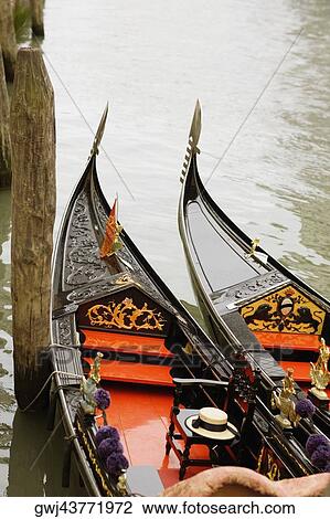 High angle view of two gondolas moored in a canal, Venice, Veneto, Italy View Large Photo Image Stock Image - High angle view of two gondolas moored in a canal, Venice, Veneto, Italy. Fotosearch