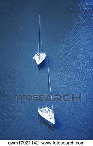 High angle view of two sail boats in the sea View Large Photo Image Stock Image - High angle view of two sail boats in the sea. Fotosearch