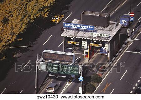 High angle view of vehicles at a toll booth on an expressway, Tokyo Prefecture, Japan View Large Photo Image Stock Image - High angle view of vehicles at a toll booth on an expressway, Tokyo Prefecture, Japan. Fotosearch