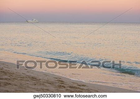 Stock Image - High angle view of waves on the beach. Fotosearch