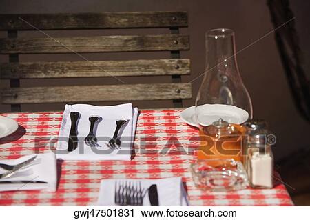 Knifes and forks with napkins on the dining table View Large Photo Image Stock Image - Knifes and forks with napkins on the dining table. Fotosearch