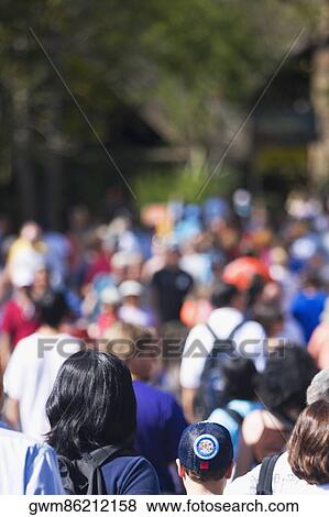 Stock Photo - Large group of people walking. Fotosearch