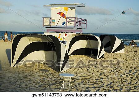 Lifeguard hut and tents on the beach View Large Photo Image Stock Photo - Lifeguard hut and tents on the beach. Fotosearch