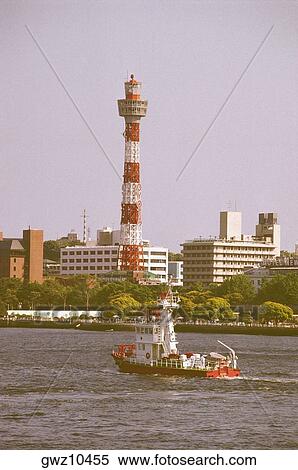 Stock Photography - Lighthouse at the waterfront, Yokohama Marine Tower, Yokohama, Kanagawa Prefecture, Japan. Fotosearch
