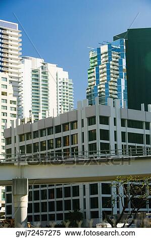 Low angle view of a bridge in front of buildings, Miami, Florida, USA View Large Photo Image Stock Photography - Low angle view of a bridge in front of buildings, Miami, Florida, USA. Fotosearch