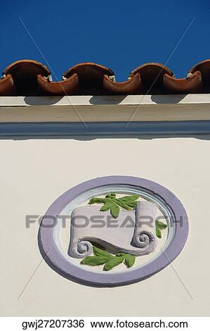 Low angle view of a design on the wall of building View Large Photo Image Stock Photograph - Low angle view of a design on the wall of building. Fotosearch