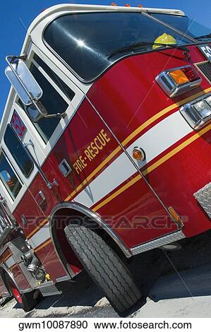 Low angle view of a fire engine on the road View Large Photo Image Stock Image - Low angle view of a fire engine on the road. Fotosearch