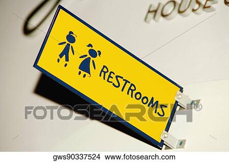 Low angle view of a Restroom sign on a wall View Large Photo Image Picture - Low angle view of a Restroom sign on a wall. Fotosearch
