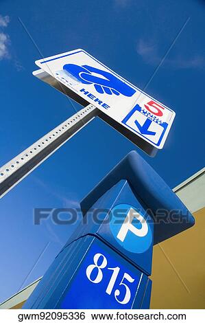 Low angle view of a signboard View Large Photo Image Stock Photograph - Low angle view of a signboard. Fotosearch