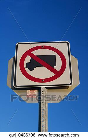 Low angle view of a warning sign View Large Photo Image Stock Photograph - Low angle view of a warning sign. Fotosearch