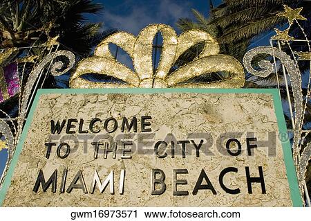 Stock Image - Low angle view of a welcome signboard, Miami Beach, Florida, USA. Fotosearch